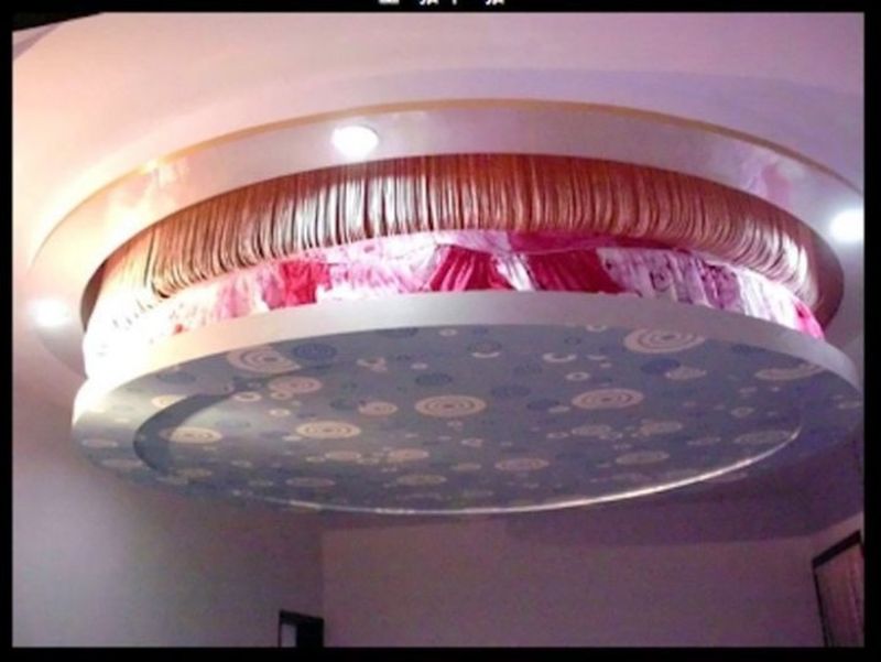 Floating retractable ceiling bed