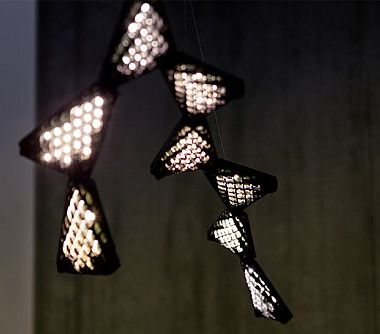 Smartphone-controlled Dragon chandelier changes shape with connectable modules