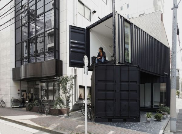 cc4441s stacked shipping containers house a modern office and art gallery space