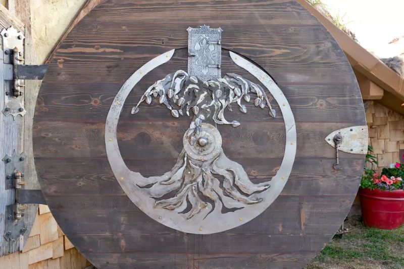 A reclaimed metal decor piece integrated at the door