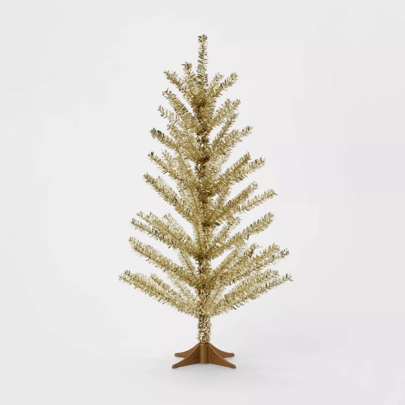 Golden tinsel tabletop Christmas tree
