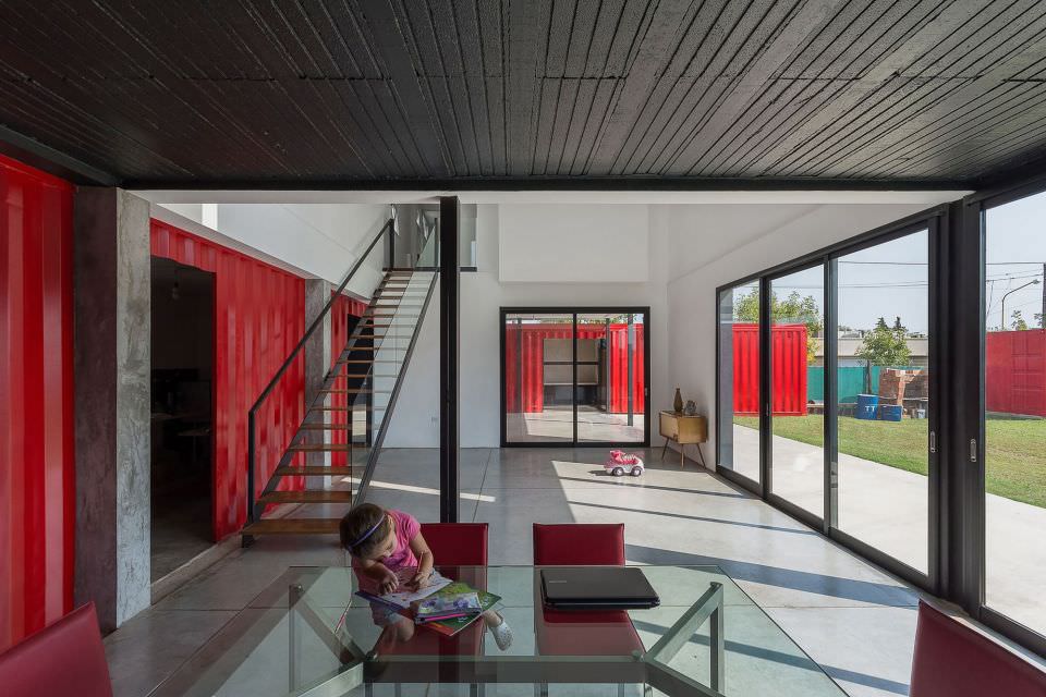 The house is designed with generous glass walls and windows