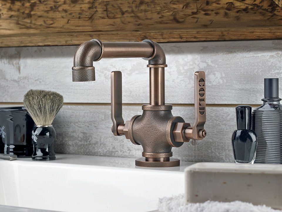The faucets are finished with intricate knurled metal