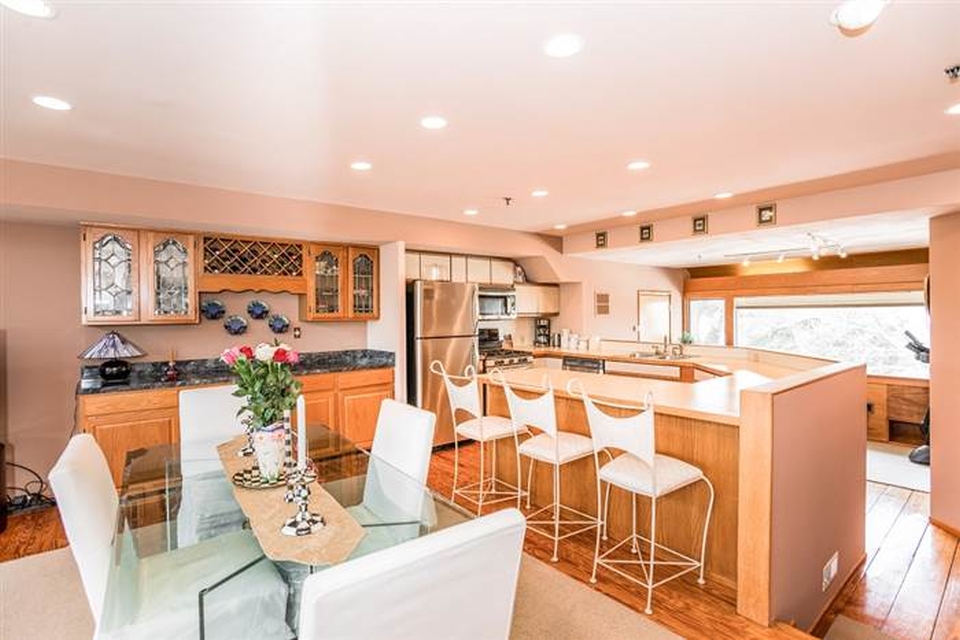 The dining room and kitchen is equipped with refrigerator, dishwasher and oven