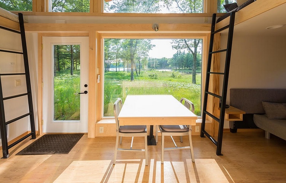 Dining area with over-sized window to create space for natural light