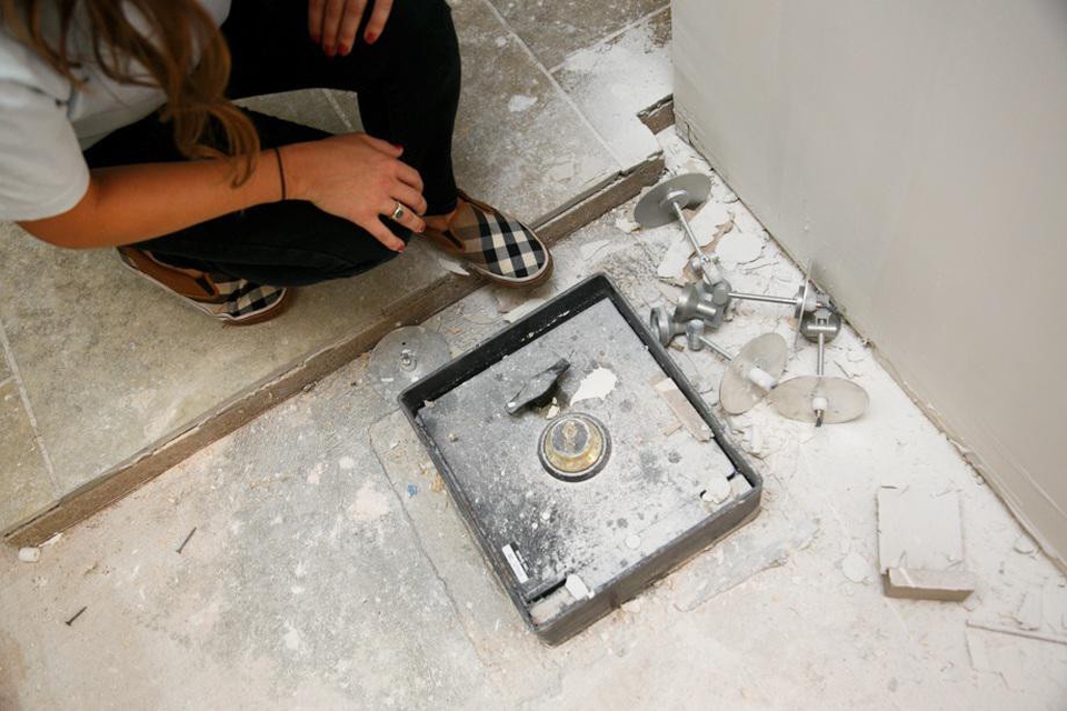 Couple discovers a mystery safe under kitchen floor