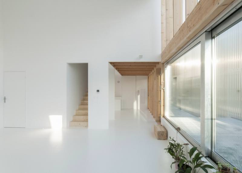 Large triple-glazed sliding doors and windows let in natural light