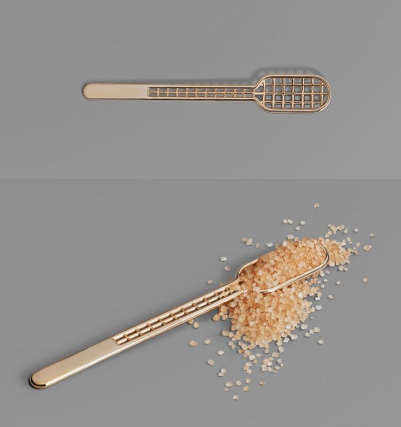 Perforated spoon with metal finishing