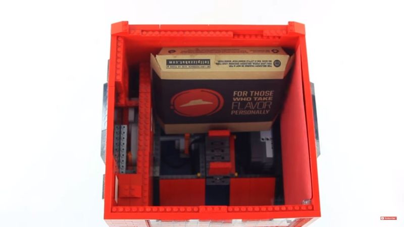 Two pizzas at a time can be placed in the mini pizza dispenser