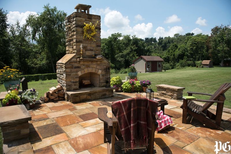 Stone patio with fireplace