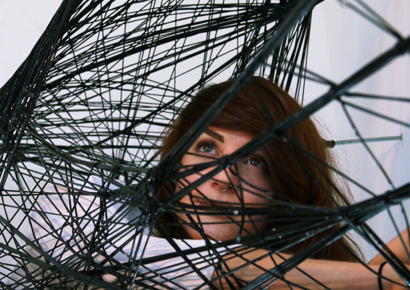 Maria Yablonina resting inside the structure made by robots