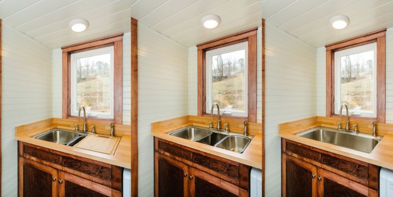 Retractable sink by side a glass window