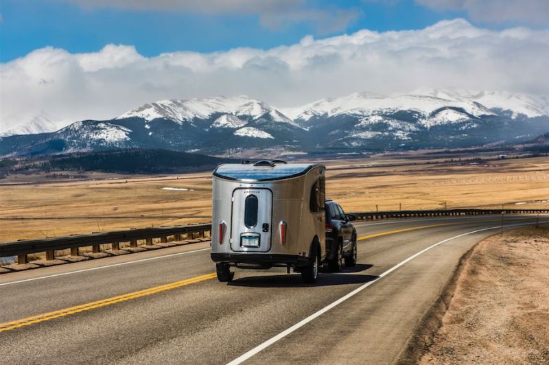 Airstream Basecamp is a shiny aluminum trailer with luxurious features