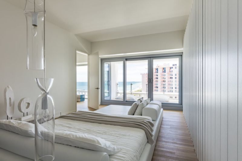 Designed with white stained oak wood and white leather