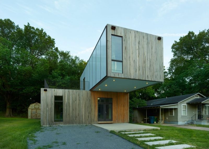 Interesting structure offers two small patios and a roof deck
