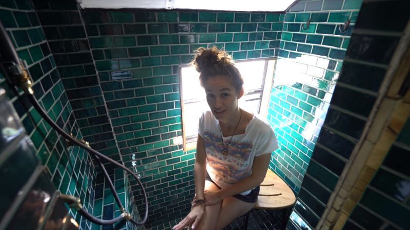 Shower designed with dark green handmade tiles by Mercury Mosaics