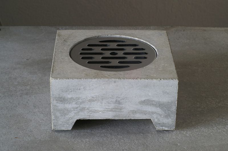Square-shaped planter with round space for growing plant