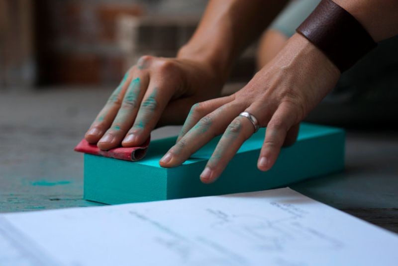 Deep sanding of colored pieces for giving it a smooth touch