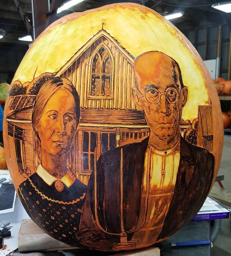 Beautifully carved pumpkin of American Gothic painting by Grant Wood