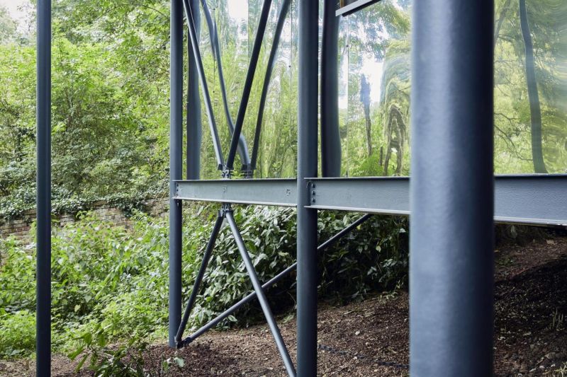Sixteen steel piles for supporting home structure