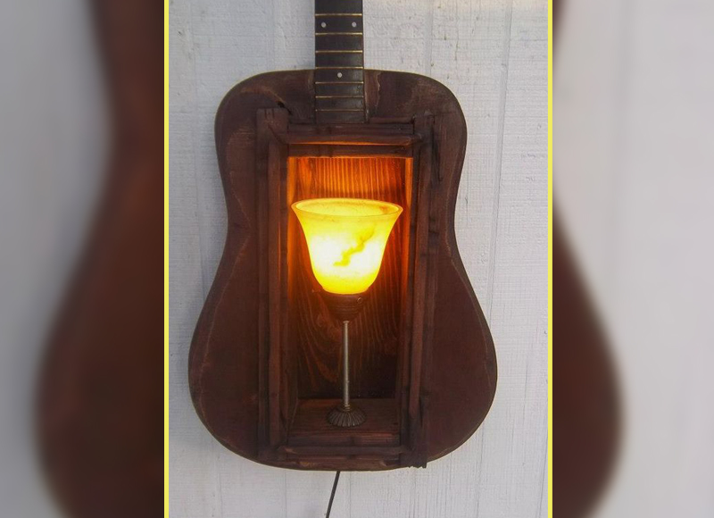 14 Ways To Use An Old Guitar To Spice Up Your Home Decor