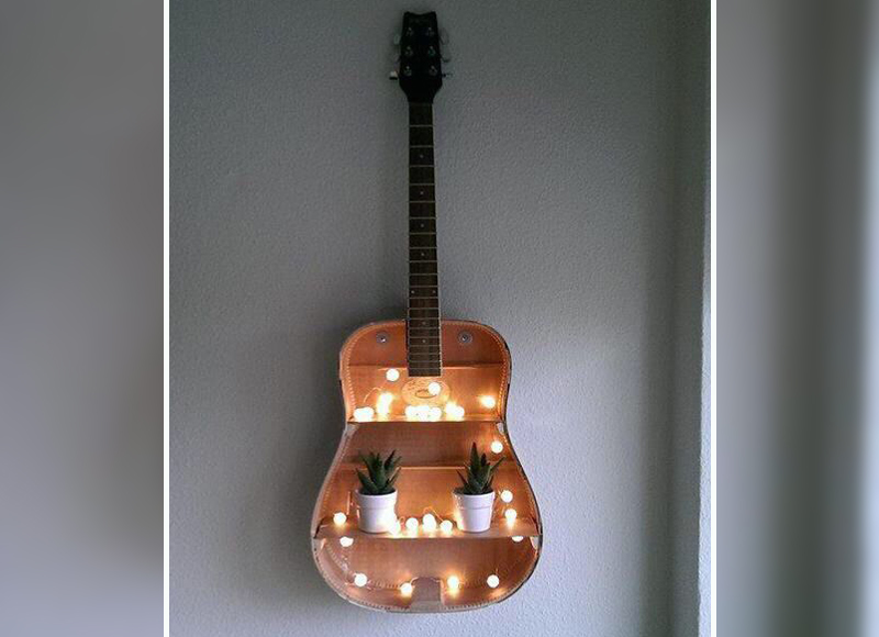 14 Ways To Use An Old Guitar To Spice Up Your Home Decor