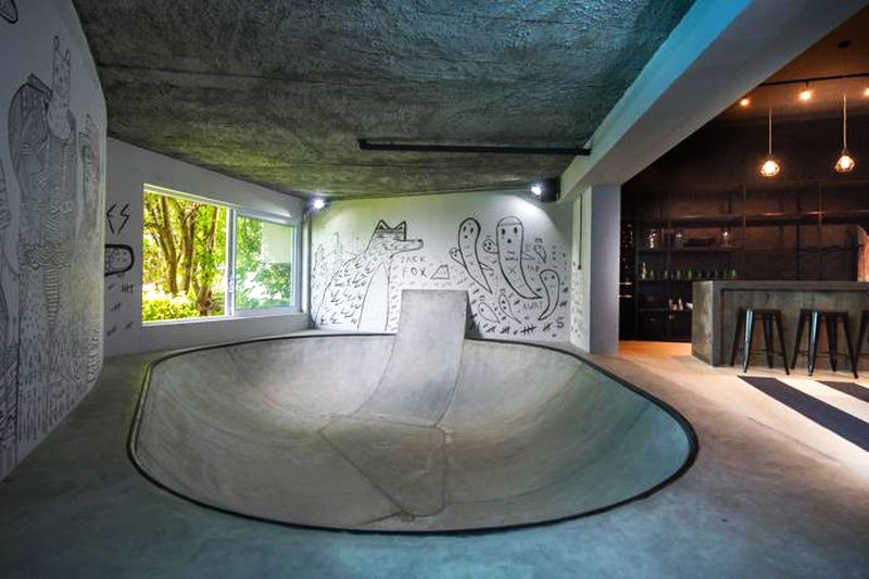 Concrete skating bowl surrounded with amazing street art