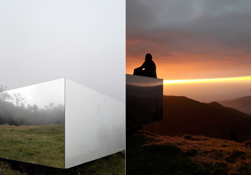 A small wooden viewing platform that is mirrored for reflecting the valleys around