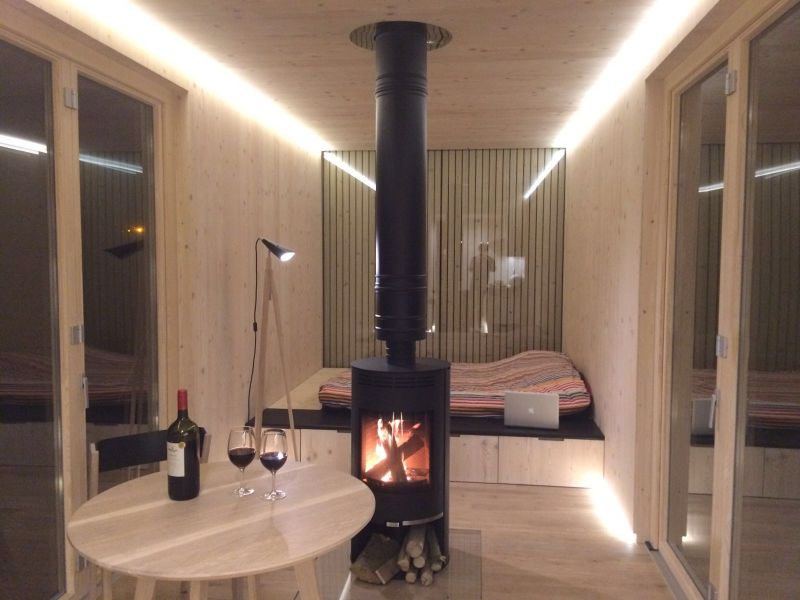 Fire place in the middle of the cabin