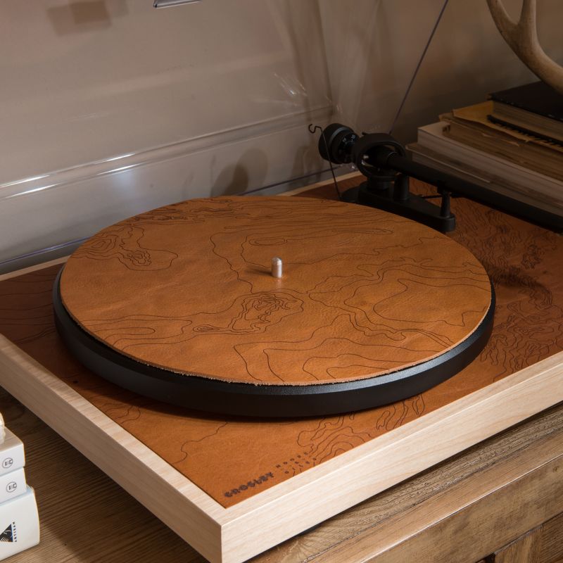 Laser-etched map on leather mat of both turntables