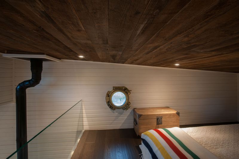 Loft bedroom with porthole window