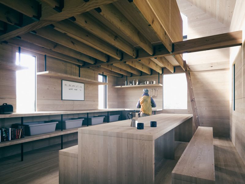 Two floored cabin had wooden interiors in living area and loft sleeping area