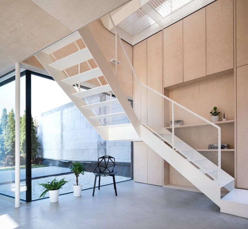 Shelving alongside stairs to first floor