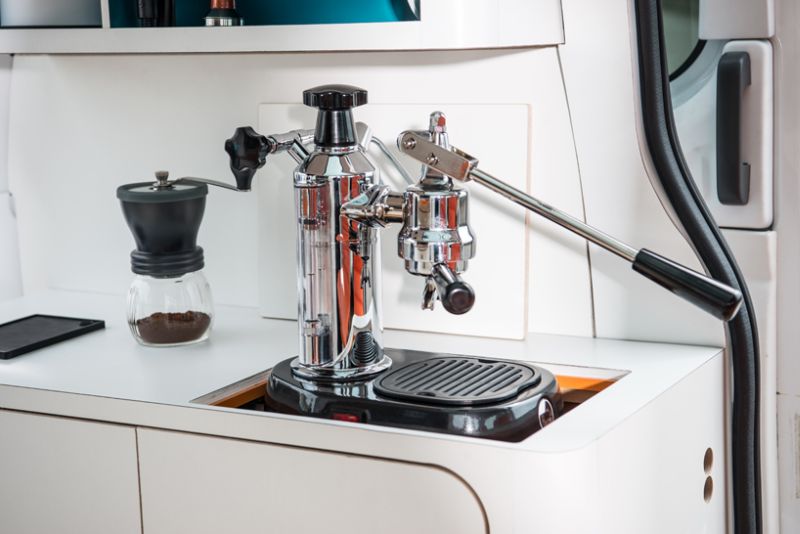 Barista-quality coffee maker hidden in a compartment