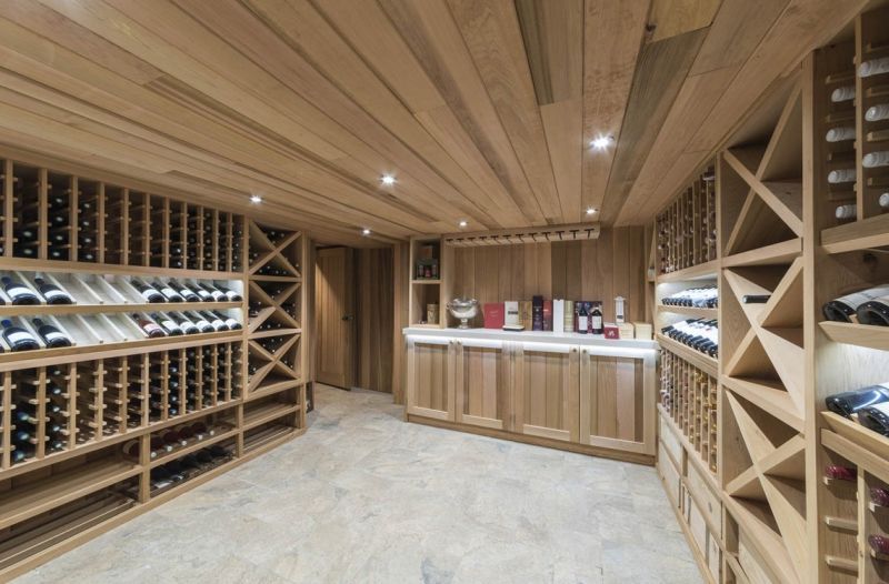 Wooden cellar designed under the staircase