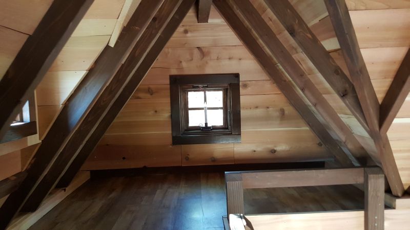 Barn wood staircase leads to the loft area