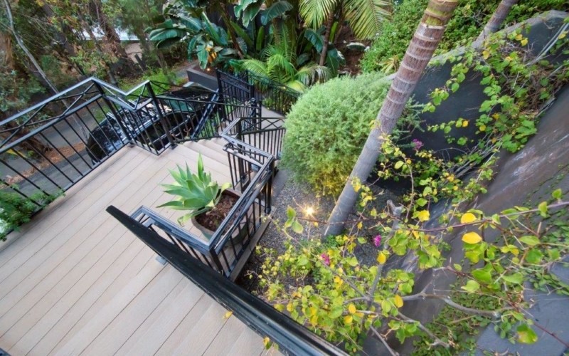 landscaped gardens and green vegetation around the property