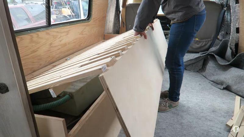 The bed opens for storage and slides out to turn into a nearly queen-sized bed