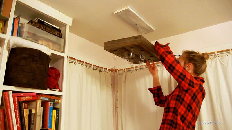 Attaching the bulbs to the hanging light fixture