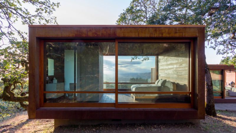 Both housing structures feature big glass walls