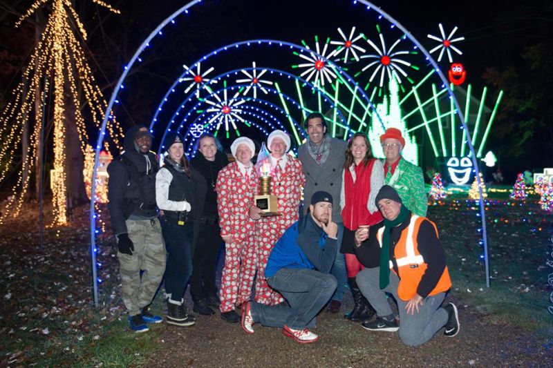 Whole family in front of the unique Christmas display