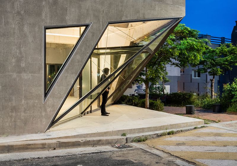 Moon Hoon builds angled concrete house in shape of an owl