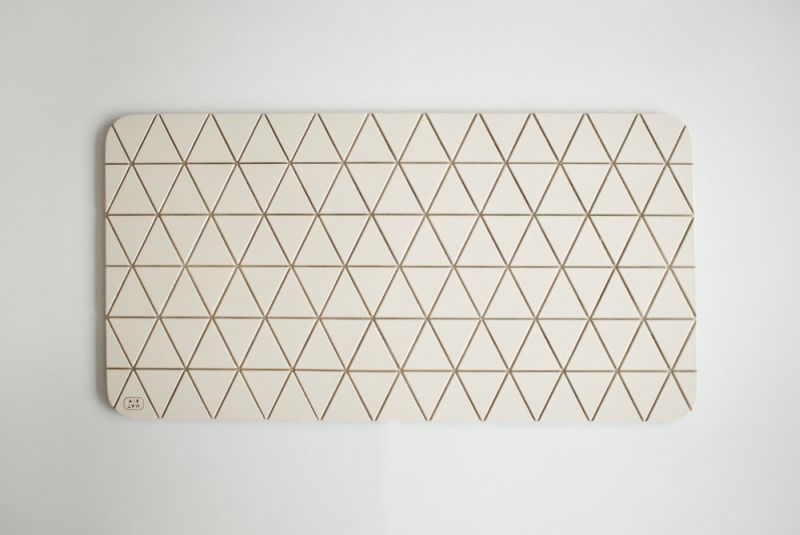 Airea wood block floor mat by Sitskie calms your legs