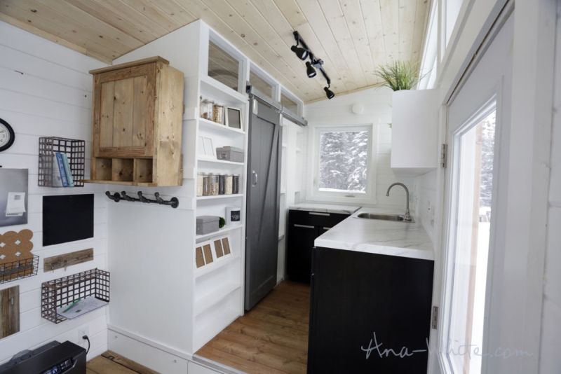 Ana White’s open concept tiny house features elevator bed to save space
