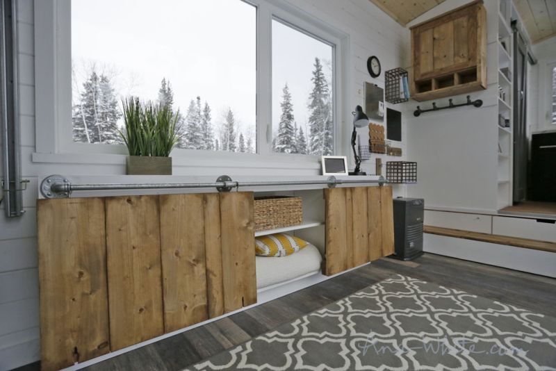 Ana White’s open concept tiny house features elevator bed to save space