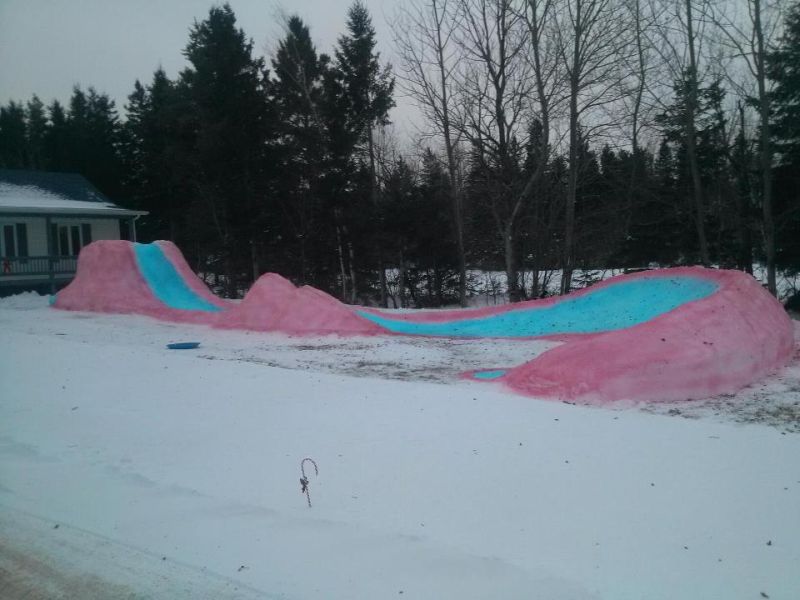 This snaking ice slide by Tracadie dad is colorful attraction for the entire neighborhood