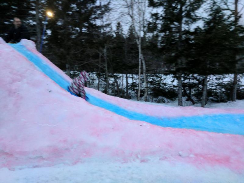 This snaking ice slide by Tracadie dad is colorful attraction for the entire neighborhood