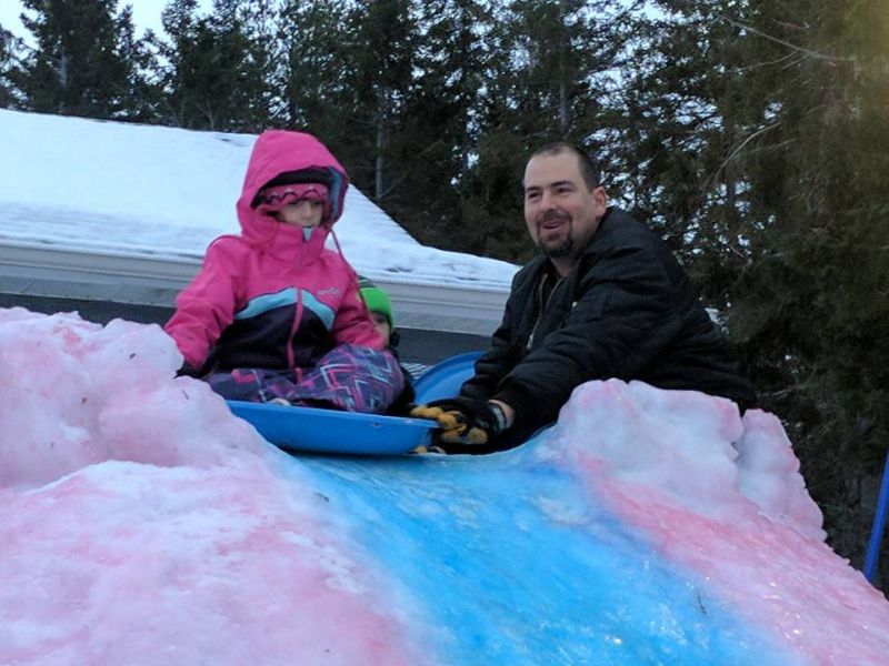 This snaking ice slide by Tracadie dad is colorful attraction for the entire neighborhood