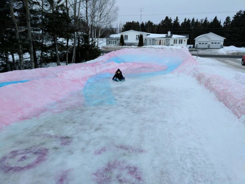 This snaking ice slide by Tracadie dad is colorful attraction for the entire neighborhood