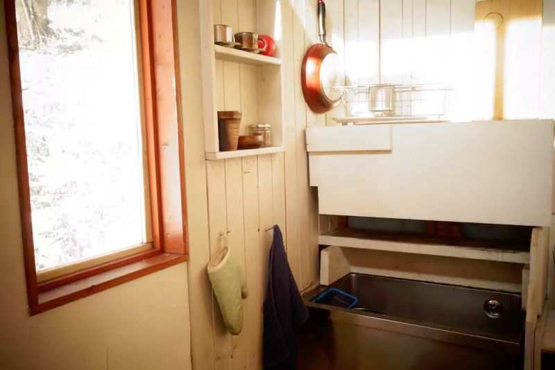 Daigo designs tiny off-grid cabin in Japanese woods